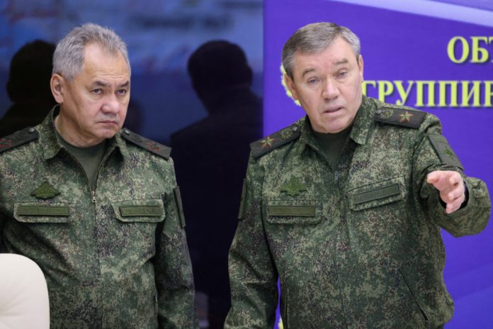 Russian Defence Minister Sergei Shoigu and Chief of the General Staff Valery Gerasimov visit the Joint Headquarters of the Russian armed forces, in an unknown location